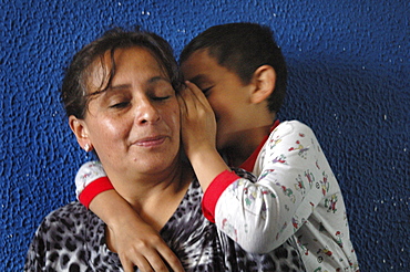 Colombia day in the life series: hugo andres, 7, of ciudad bolivar, bogota, with his mother ageda, 44