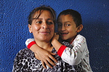 Colombia day in the life series: hugo andres, 7, of ciudad bolivar, bogota, with his mother ageda, 44