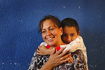 Colombia day in the life series: hugo andres, 7, of ciudad bolivar, bogota, with his mother ageda, 44