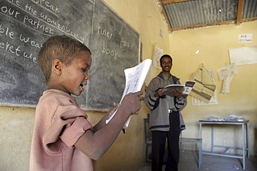 Ethiopia catholic elementary school at wutafa, tigray. Boy reading english