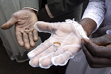 Kenya at a wedding mass, kibera slum, nairobi. Three couples were married at the same time, by american maryknoll priest, father bob jalbert