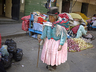 BOLIVIA Street scenes in La Paz. Old woman walking