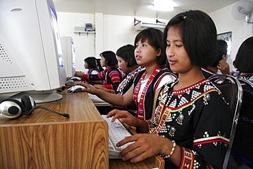 Thailand lisu tribal schoolgirls using computers in their secondary school at chiang dao village, near chiang mai