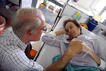 Thailand hiv+ patients in an aids hospice at a buddhist temple in lopburi, being cared for by father mike bassano, a maryknoll priest dedicating his life to serve the sick and needy