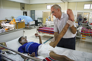 Thailand hiv+ patients in an aids hospice at a buddhist temple in lopburi, being cared for by father mike bassano, a maryknoll priest dedicating his life to serve the sick and needy