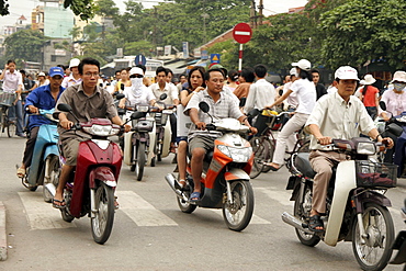 Vietnam street scene in hanoi with heavy traffic, especially bicycles and motorcycles