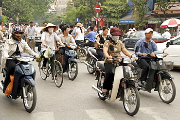 Vietnam street scene in hanoi with heavy traffic, especially bicycles and motorcycles