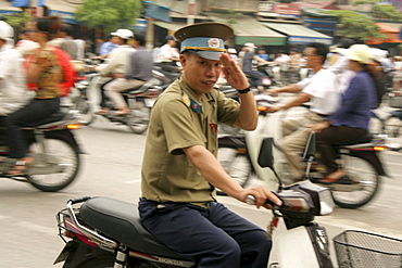 Vietnam street scene in hanoi with heavy traffic, especially bicycles and motorcycles