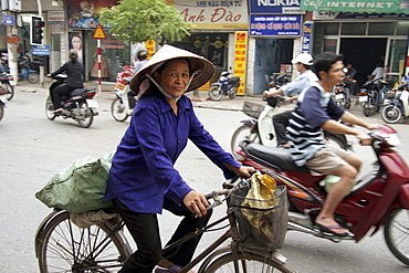 Vietnam street scene in hanoi with heavy traffic, especially bicycles and motorcycles