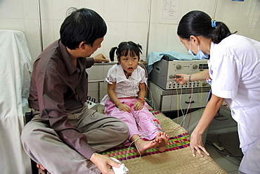 Vietnam child receiving acupuncture treatment at hospital in hanoi