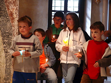 Macedonia (the former yugoslav republic of macedonia, fyrm) children attending easter sunday service at saint sofia orthodox church, ohrid. Mass is lead by archbishop timotei