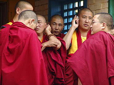 Mongolia buddhist monks using cell phones gandan monastery, ulaan baatur. Main gate