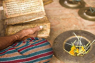 A Pilgrim reads his Hindu scripture. Bhaktapur, Nepal