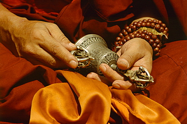 Tantric ritual impliments of, on right hand is (drilbubell on left is dorje, symbolizing male female principle, skillful means wisdom 