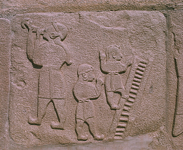 Copy at archaeological sites of Hittite relief showing sword swallowers and acrobats, Alaca Huyuk, Anatolia, Turkey, Asia Minor, Eurasia