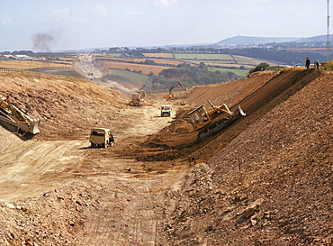 Earthmovers and other machines used in the construction of a new A30 by-pass section of the Cranborne to Hayle road, Cornwall, England, United Kingdom, Europe