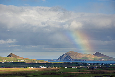 Rainbow over hills and dwellings, looking towards Clogher and Rosroe, Dingle Peninsula, County Kerry, Munster, Republic of Ireland, Europe