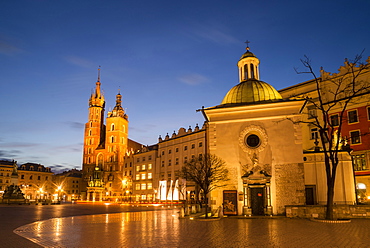 St. Mary's Church (St. Marys Basilica) and main square illuminated at dawn, UNESCO World Heritage Site, Krakow, Poland, Europe