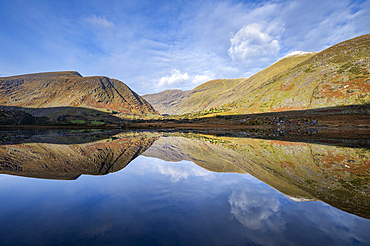 Macgillycuddy's Reeks Mountains reflected in lake at sunrise, County Kerry, Munster, Republic of Ireland