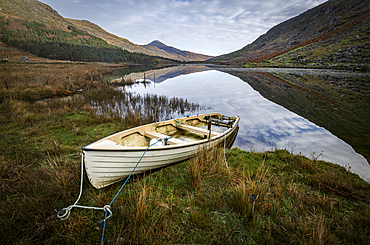 Boat moored on lakeside, The Black Valley, County Kerry, Munster, Republic of Ireland