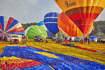 Hot-air balloons preparing to take off from the festival site during the annual Bristol International Balloon Fiesta, Bristol, England, United Kingdom, Europe