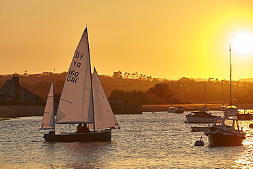 A sunset view of sailing on the River Exe at Topsham, near Exeter, Devon, England, United Kingdom, Europe