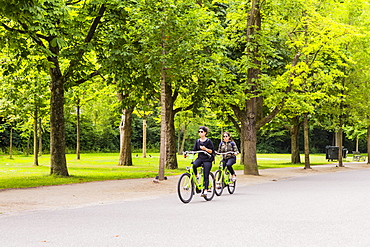 People cycling in Vondelpark, Amsterdam, Netherlands, Europe