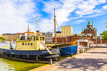 Boats docked at the harbour in Helsinki with Uspenski cathedral in the background, Uusimaa, Finland, Scandinavia, Europe