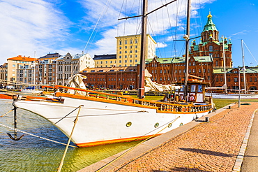 Boats docked at the harbour in Helsinki with Uspenski cathedral in the background, Uusimaa, Finland, Scandinavia, Europe