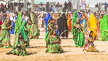 Female dancers at the opening ceremony of the Pushkar Camel Fair, Pushkar, Rajasthan, India, Asia