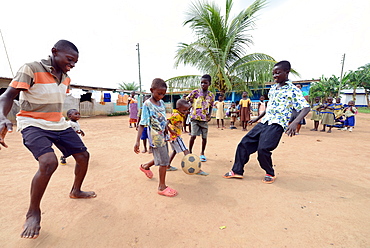 Boys playing football, Adiembra, Ghana, West Africa, Africa