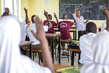 Teacher Rebecca Ngovano talks to students during a class taken with VSO volunteer Paul Jennings, Angaza school, Lindi, Tanzania, East Africa, Africa