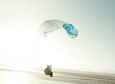 Paragliders soar over the Dee estuary, Wirral, Cheshire, England, United Kingdom, Europe