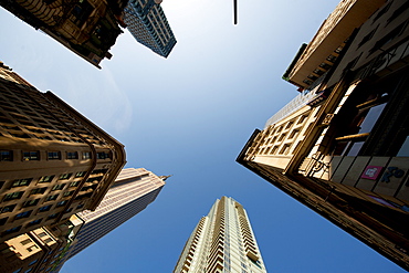 Looking up through skyscrapers at the Empire State, New York, United States of America, North America