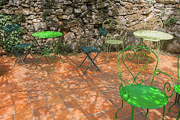 Patio seating in a shady French garden, France, Europe