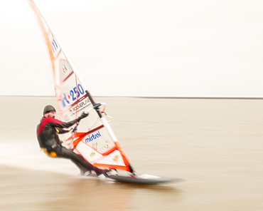 Windsurfer travelling at speed at West Kirby Marine Lake, Wirral, United Kingdom, Europe