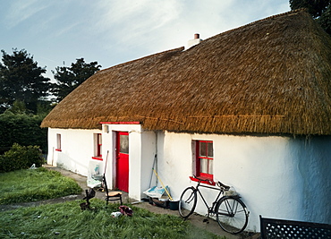 Thatched house and bicycle, Co Kildare, Republic of Ireland, Europe