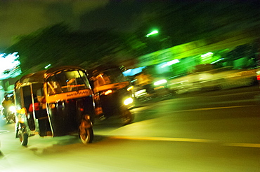 Speeding tuk-tuk at night, Mumbai (Bombay), India, South Asia