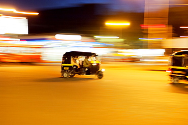 Speeding tuck-tuk at night, Mumbai (Bombay), India, South Asia