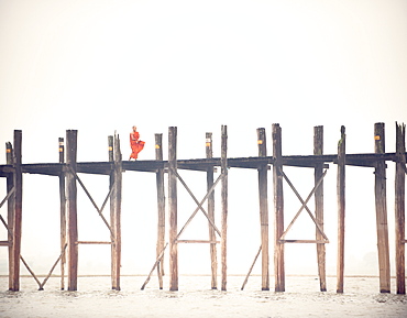 Monk crossing the U Bein Bridge, Taungthaman Lake, Amarapura near Mandalay, Myanmar (Burma), Asia