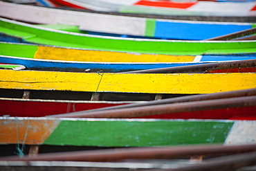 Brightly coloured boats at the U Bein Bridge, Taungthaman Lake, Amarapura near Mandalay, Myanmar (Burma), Asia