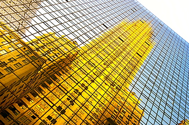 The Chrysler Building reflected in modern glass skyscraper, Lexington Avenue, New York, United States of America, North America