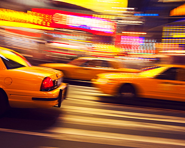 Traditional yellow taxi at night, New York City, United States of America, North America