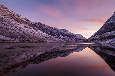 Loch Achtriochtan in winter with snow-capped mountains and reflections, Glencoe, Highlands, Scotland, United Kingdom, Europe