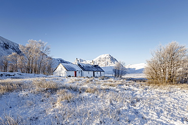 A winter scene at Black Rock cottage and Buachaille Etive Mor on Rannoch Moor, Highlands, Scotland, United Kingdom, Europe