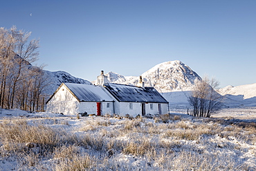 A wintery scene at Black Rock cottage and Buachaille Etive Mor on Rannoch Moor, Highlands, Scotland, United Kingdom, Europe