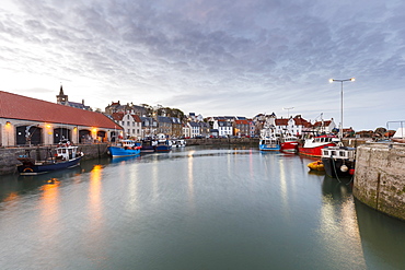 Fishing boats at dusk in the harbour at Pittenweem, Fife, East Neuk, Scotland, United Kingdom, Europe