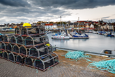 Sailing boats and crab pots at dusk in the harbour at Anstruther, Fife, East Neuk, Scotland, United Kingdom, Europe