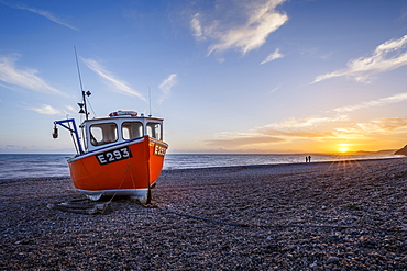 Fishing boat moored on Branscombe Beach at sunset, Seaton, East Devon, England, United Kingdom, Europe