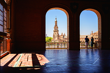 Tourists viewing the Plaza de Espana in Parque de Maria Luisa at night, Seville, Andalucia, Spain, Europe